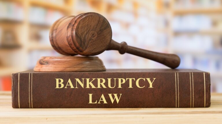 gavel resting on a bankruptcy law book