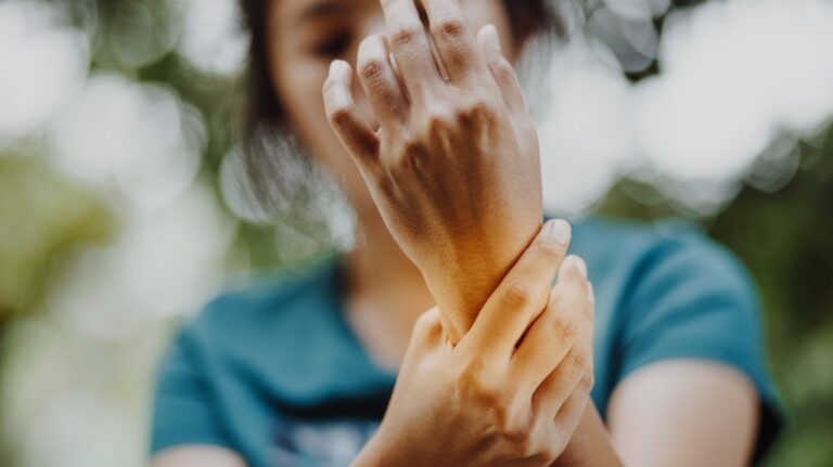 holding injured wrist
